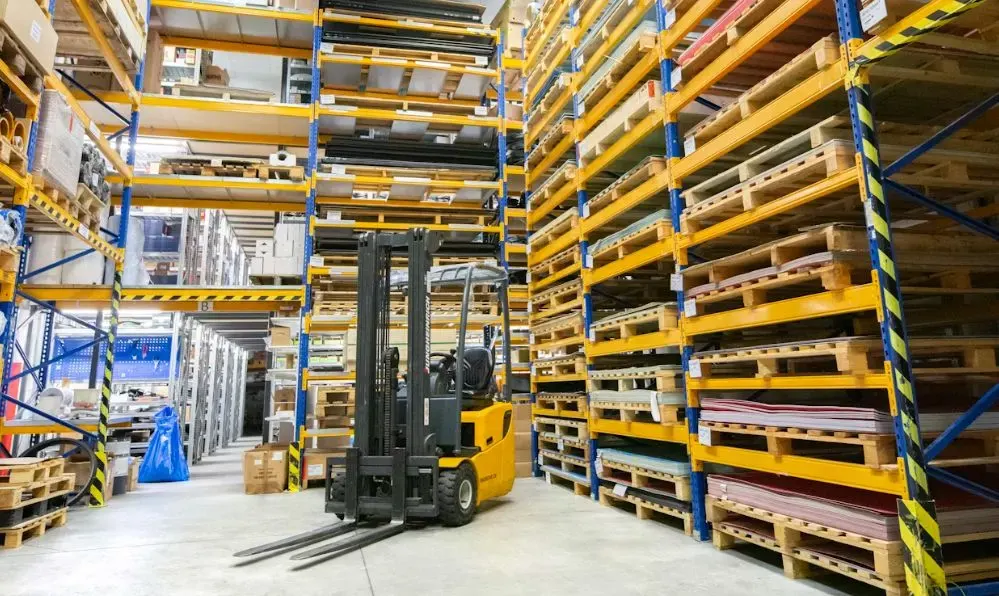Forklift in a high-bay aisle